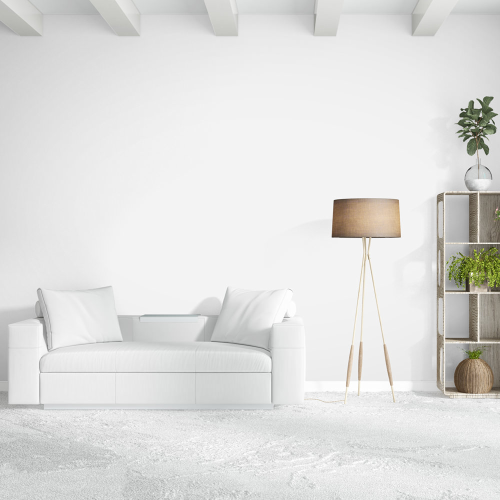 white couch on top of white carpet in living room