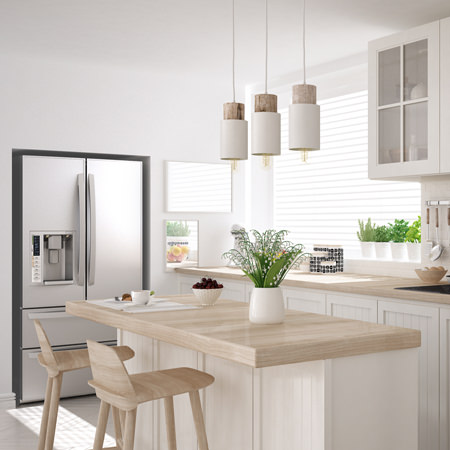 white kitchen with island and two chairs